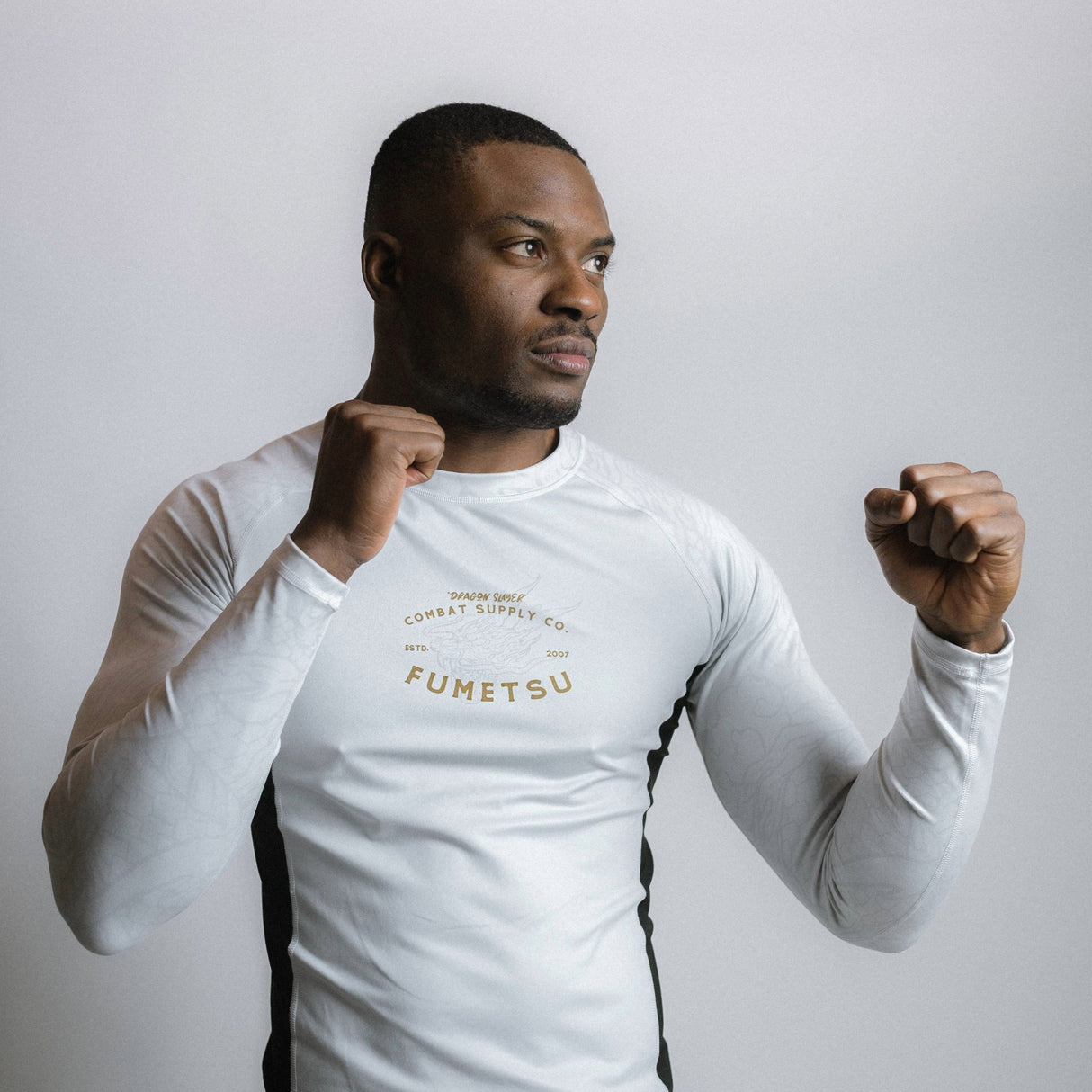 Fumetsu Dragon Slayer Long Sleeve Rash Guard White/Black/Gold at Bytomic Trade and Wholesale