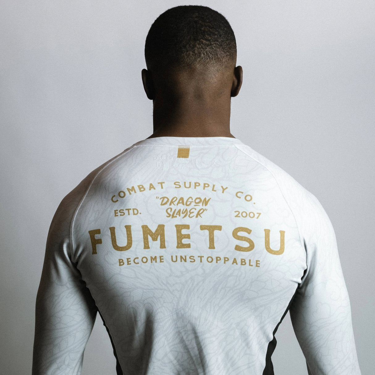 Fumetsu Dragon Slayer Long Sleeve Rash Guard White/Black/Gold at Bytomic Trade and Wholesale