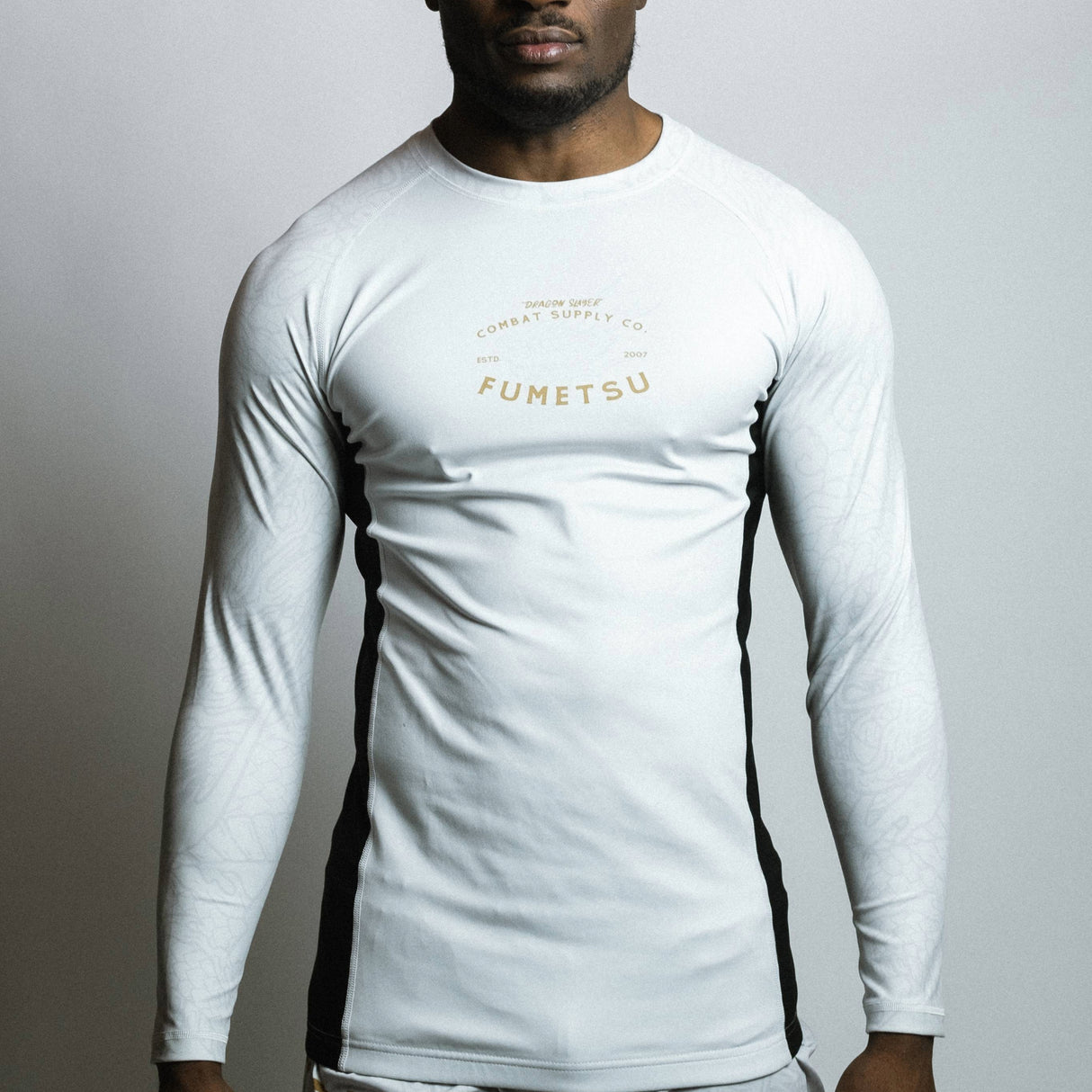 Fumetsu Dragon Slayer Long Sleeve Rash Guard White/Black/Gold at Bytomic Trade and Wholesale
