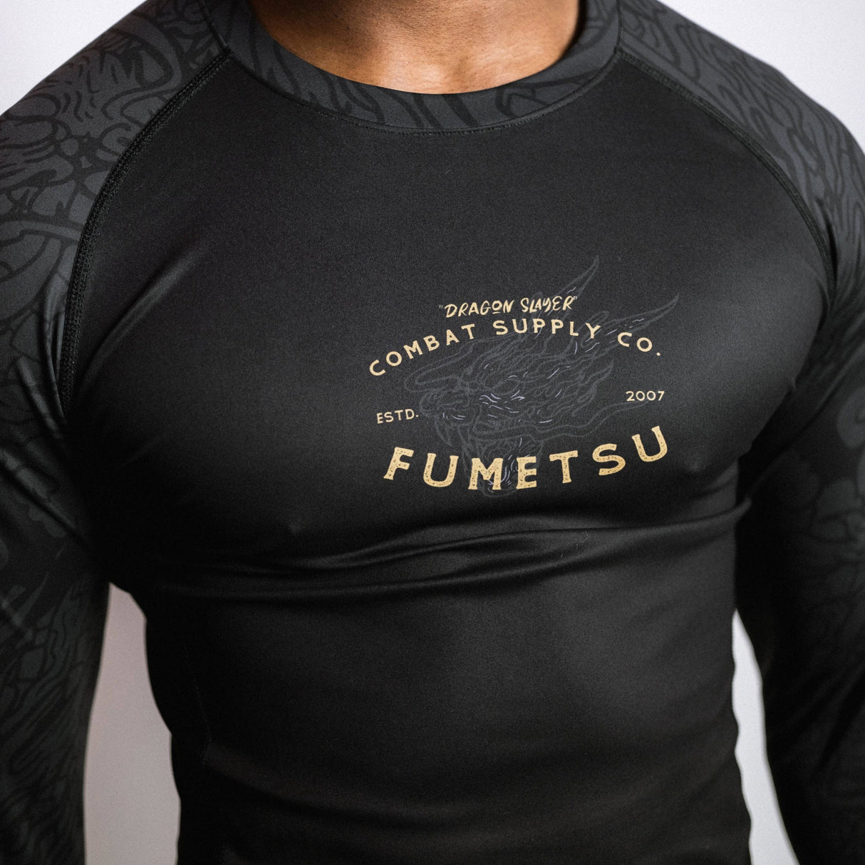 Fumetsu Dragon Slayer Long Sleeve Rash Guard Black/Gold at Bytomic Trade and Wholesale