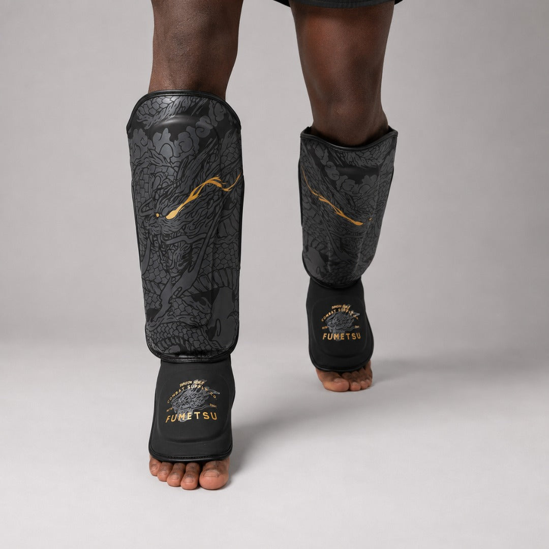 Fumetsu Dragon Slayer Shin Guards Black/Gold at Bytomic Trade & Wholesale 2