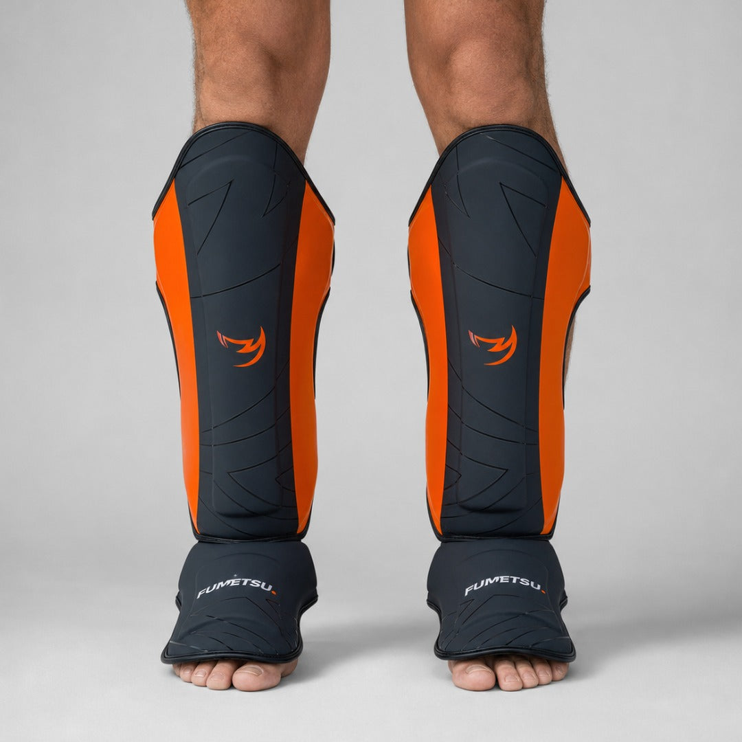 Fumetsu Icon Thai Shin Guards Black/Orange at Bytomic Wholesale