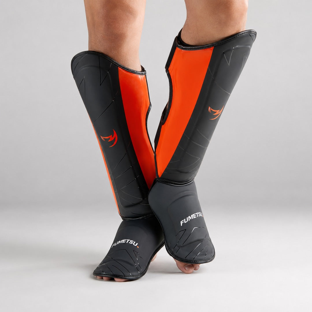 Fumetsu Icon Thai Shin Guards Black/Orange at Bytomic Wholesale 3