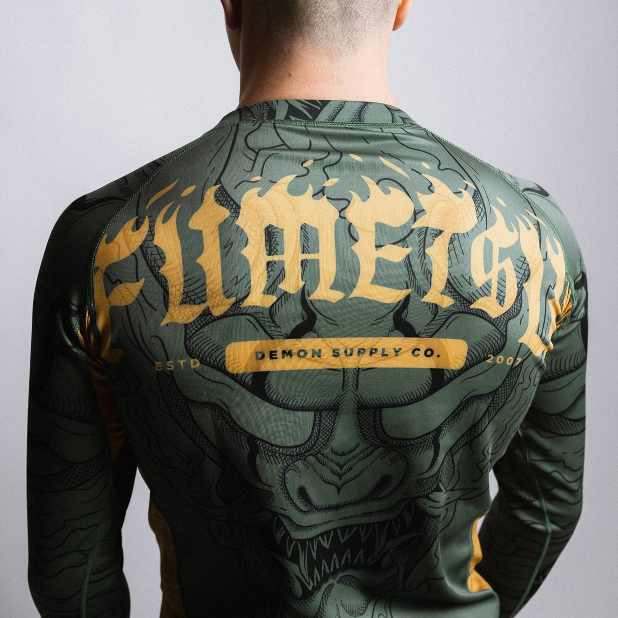 Fumetsu Oni Long Sleeve Rash Guard Khaki/Gold/Black at Bytomic Trade and Wholesale