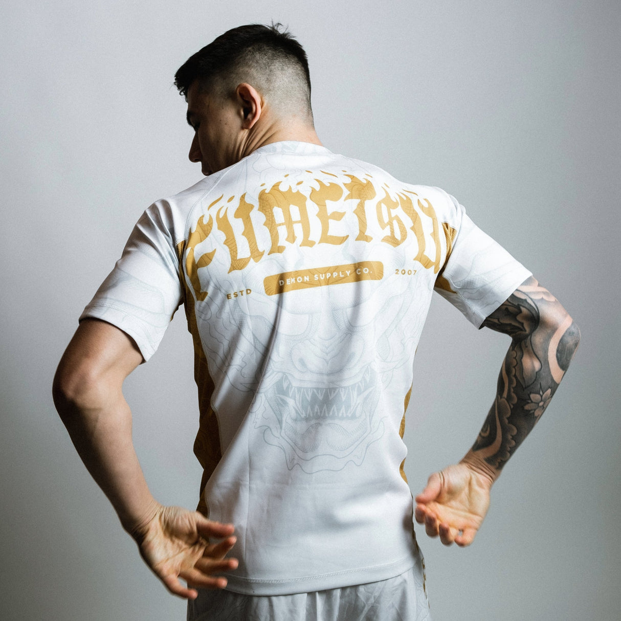 Fumetsu Oni Short Sleeve Rash Guard White/Gold/Grey at Bytomic Trade and Wholesale