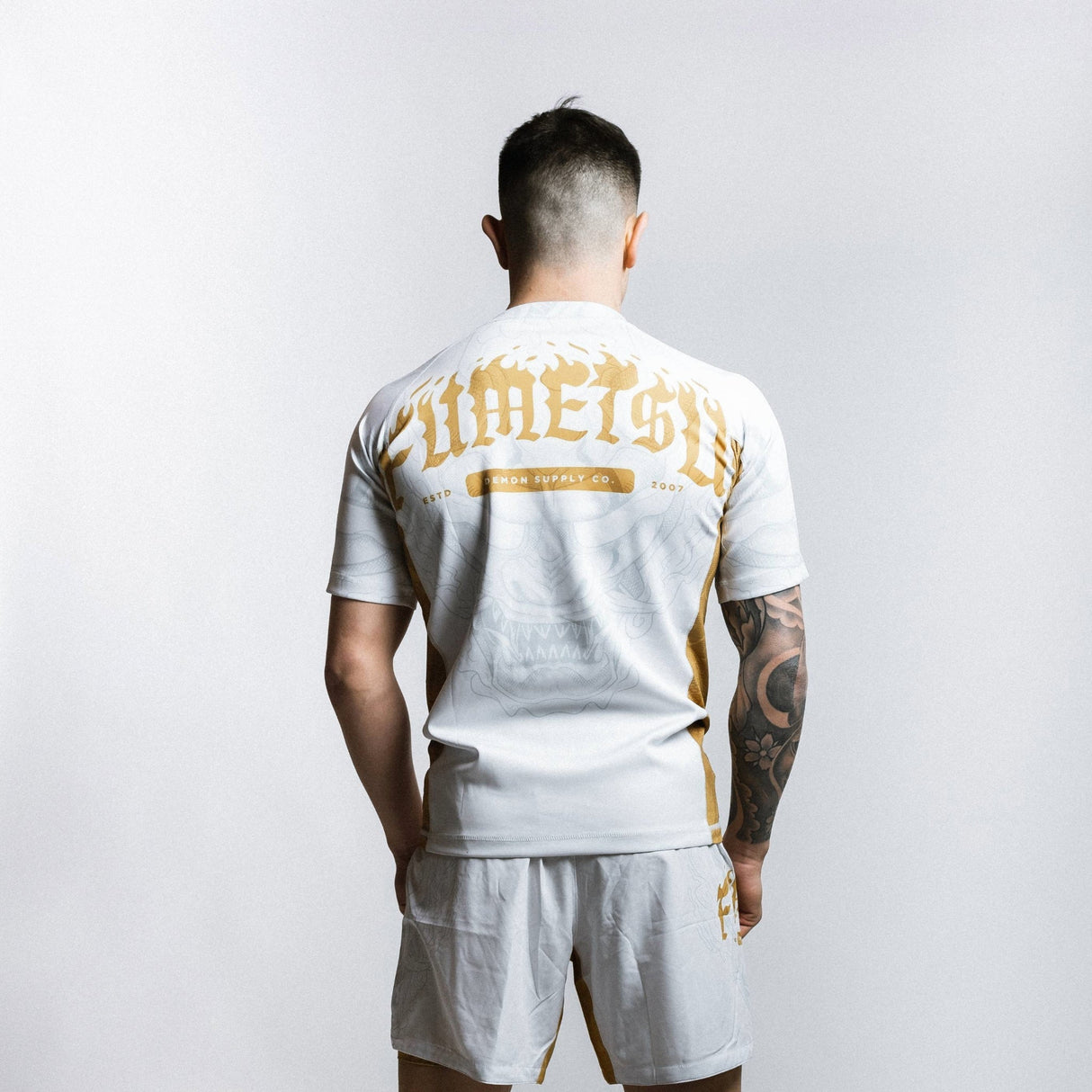 Fumetsu Oni Short Sleeve Rash Guard White/Gold/Grey at Bytomic Trade and Wholesale