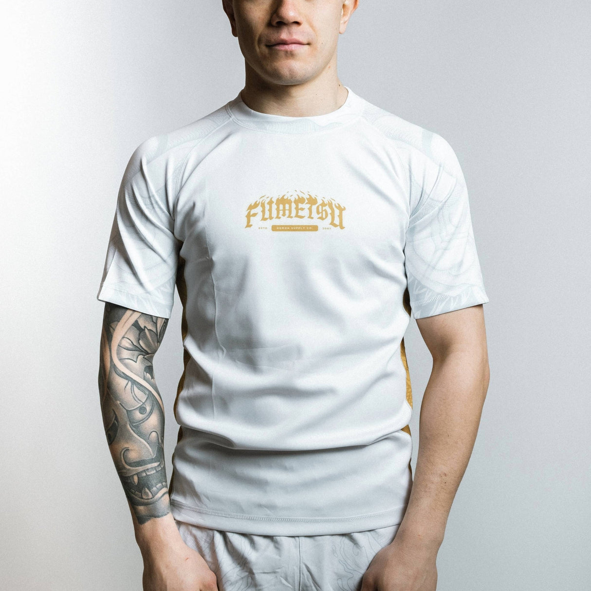 Fumetsu Oni Short Sleeve Rash Guard White/Gold/Grey at Bytomic Trade and Wholesale