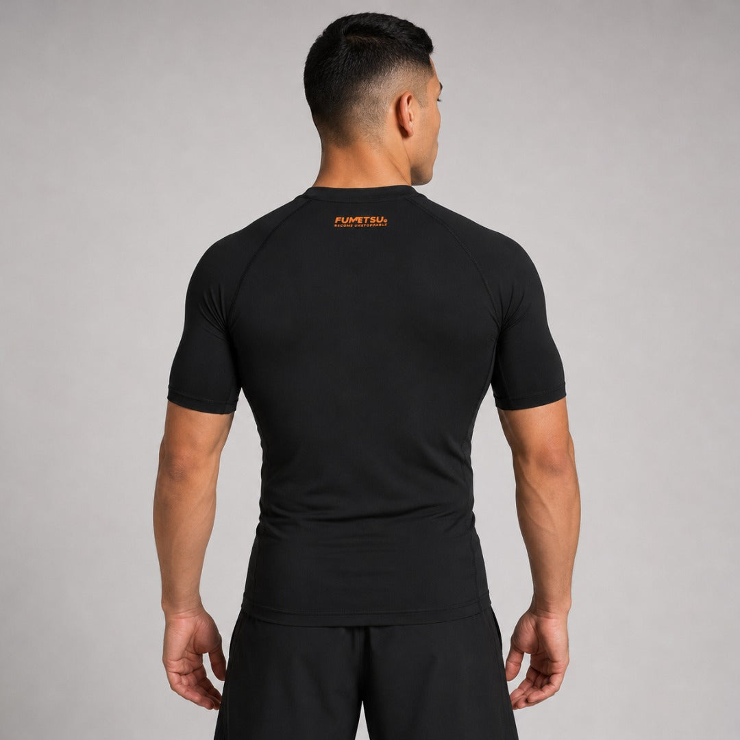 Fumetsu Origins Short Sleeve Rash Guard Black/Orange