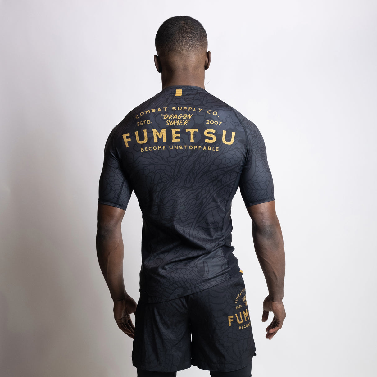 Fumetsu Dragon Slayer Short Sleeve Rash Guard Black/Gold at Bytomic Trade and Wholesale