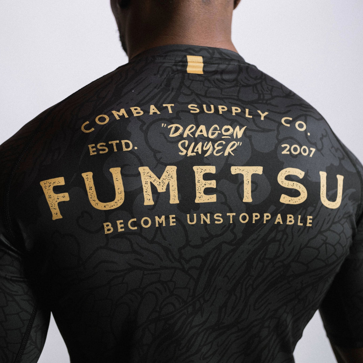 Fumetsu Dragon Slayer Short Sleeve Rash Guard Black/Gold at Bytomic Trade and Wholesale