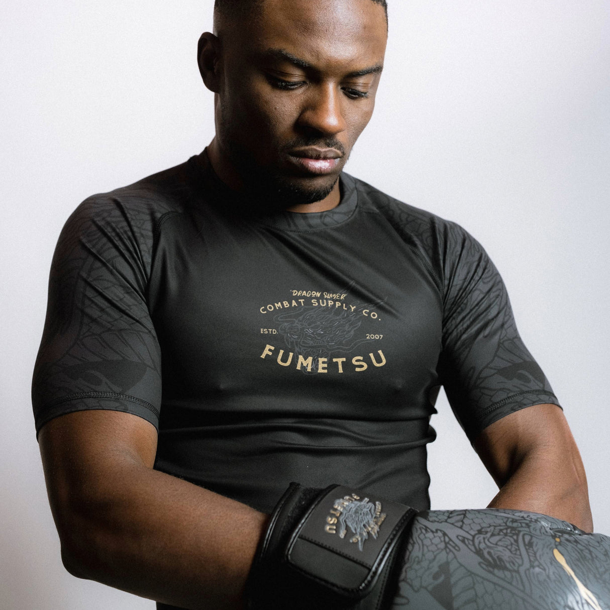 Fumetsu Dragon Slayer Short Sleeve Rash Guard Black/Gold at Bytomic Trade and Wholesale
