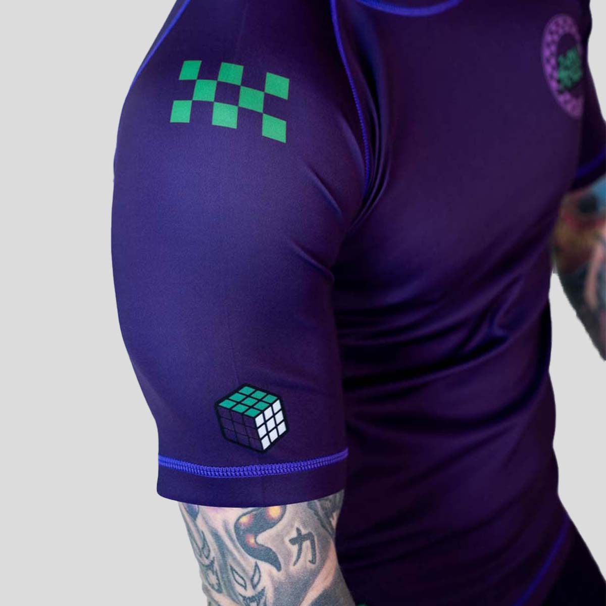 Roll Supreme The Finisher Short Sleeve Rash Guard Purple/Green at Bytomic Trade and Wholesale