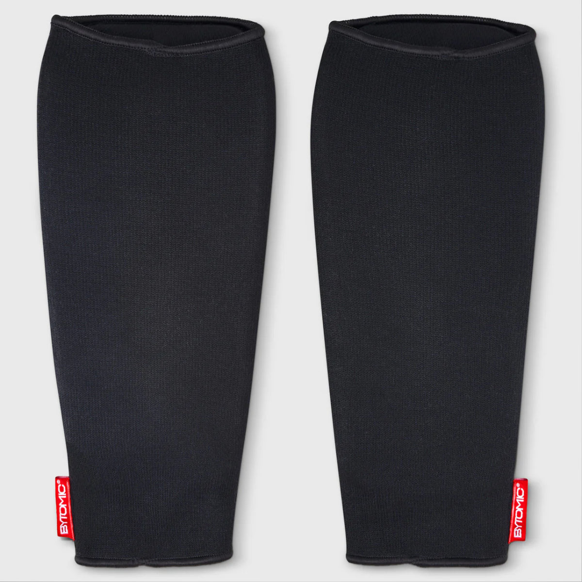 Black/White Bytomic Red Label Elasticated Shin Guards at Bytomic Trade and Wholesale