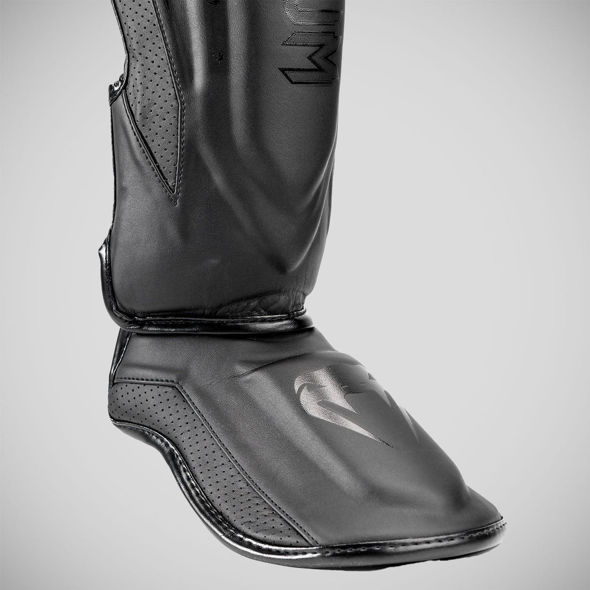 Black/Black Venum Elite Evo Shin Guards at Bytomic Trade and Wholesale