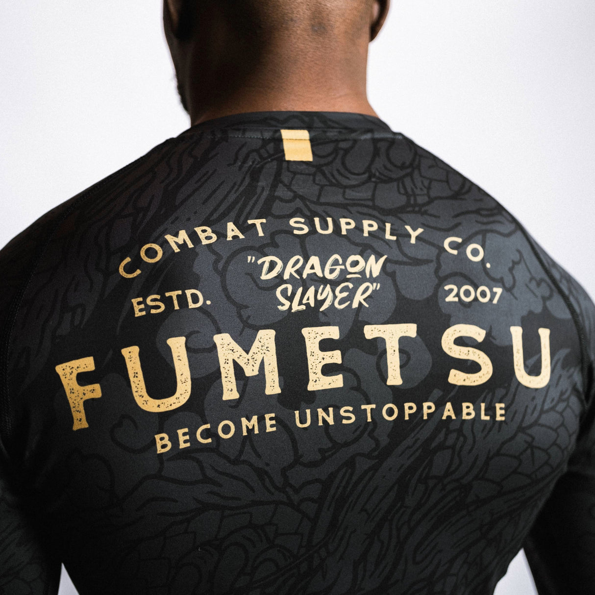 Fumetsu Dragon Slayer Long Sleeve Rash Guard Black/Gold at Bytomic Trade and Wholesale