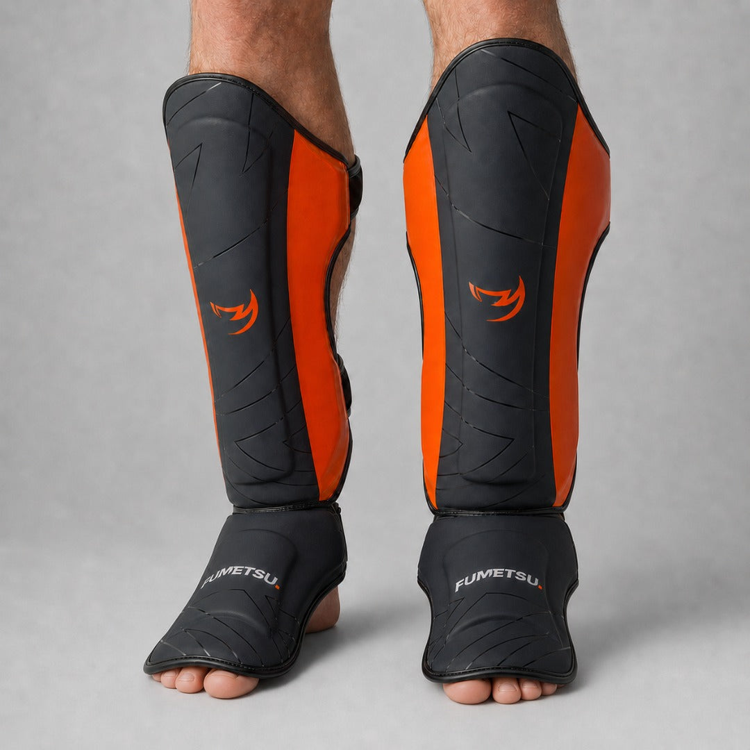 Fumetsu Icon Thai Shin Guards Black/Orange at Bytomic Wholesale 2