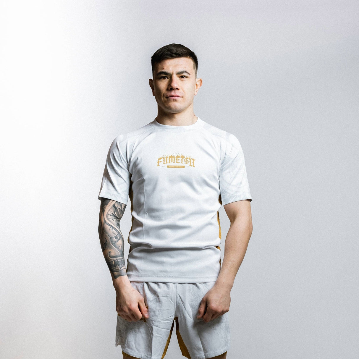 Fumetsu Oni Short Sleeve Rash Guard White/Gold/Grey at Bytomic Trade and Wholesale