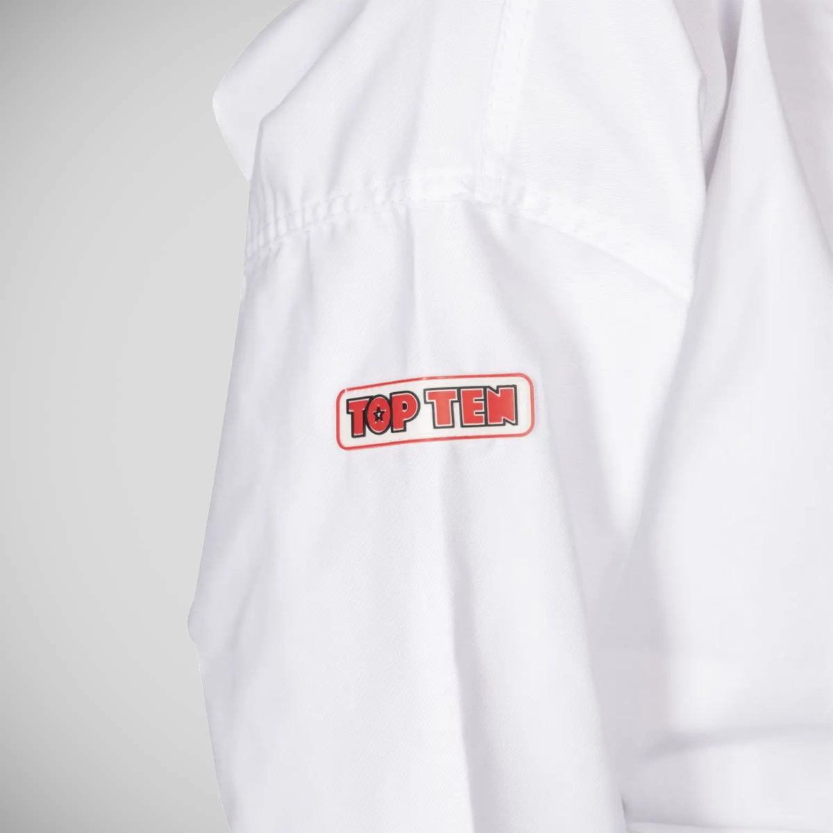 White Top Ten ITF Student Uniform with Slip Jacket    at Bytomic Trade and Wholesale