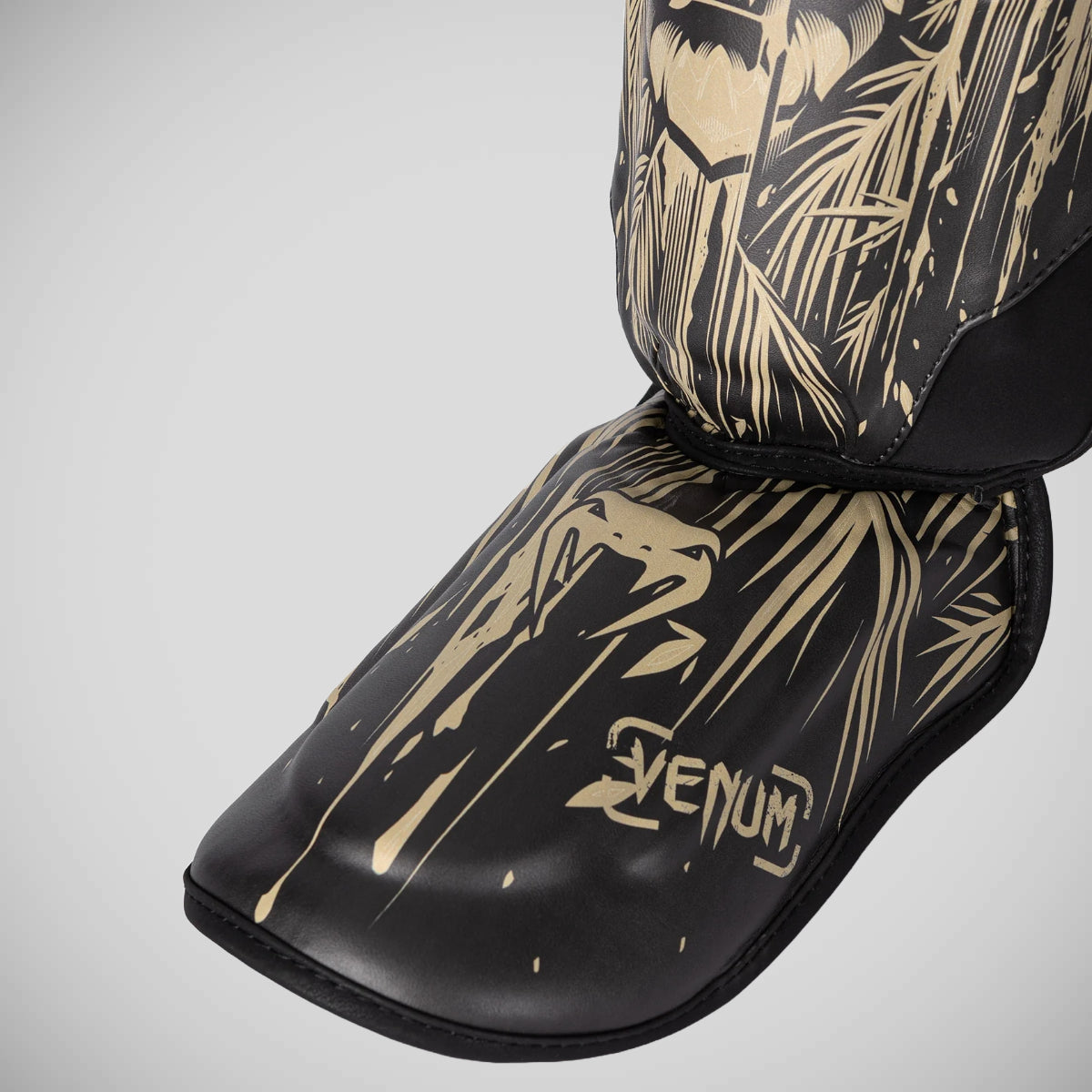 Venum Tiger Kids Shin Guards Black/Orange at Bytomic Trade and Wholesale
